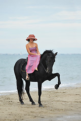 Image showing girl and  horse on the beach