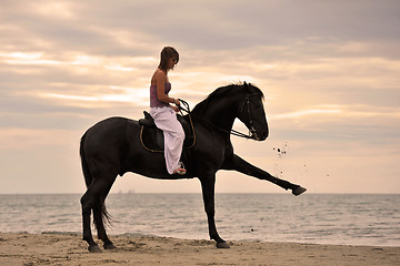 Image showing girl and  horse on the beach