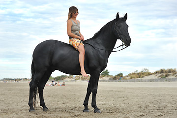 Image showing woman and  horse on the beach