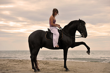 Image showing girl and  horse on the beach