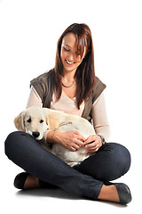 Image showing puppy golden retriever and woman