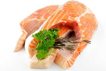 Image showing Fresh steak of trout with parsley and rosemary