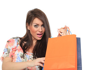 Image showing Portrait of stunning young woman carrying shopping bags