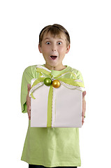 Image showing Excited boy holding a wrapped present