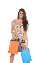 Image showing Portrait of stunning young woman carrying shopping bags