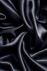 Image showing Smooth elegant black silk as background