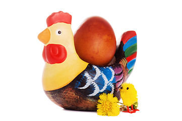 Image showing The wooden hen about an egg, it is isolated on white