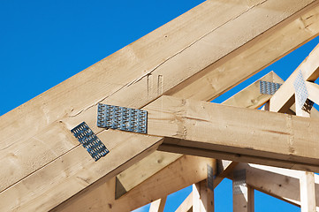 Image showing Wooden rafters against the blue sky