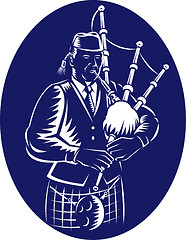 Image showing Bagpiper Playing Scottish Great Highland Bagpipe