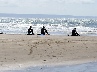 Image showing Three Surfers