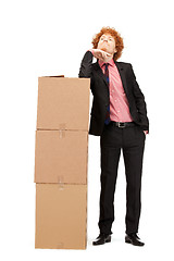 Image showing attractive businessman with big boxes