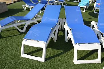 Image showing chairs at poolside