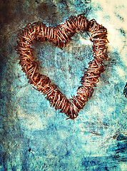 Image showing grunge heart on blue wall