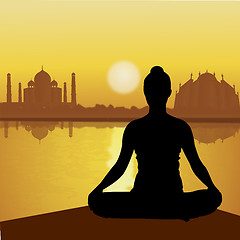 Image showing human doing yoga with taj mahal background, lake side