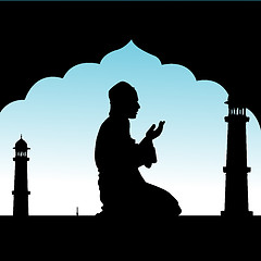 Image showing silhouette of human offering prayers at mosque