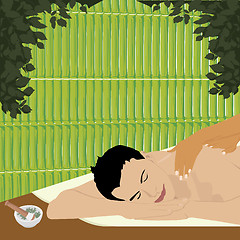 Image showing man having an ayurvedic massage in a bamboo shed