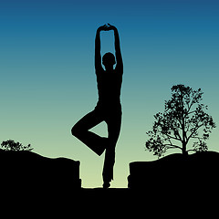 Image showing silhouette view of human doing yoga, standing position