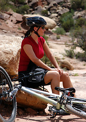 Image showing Woman mountain biking