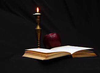 Image showing Reading by Candle Light