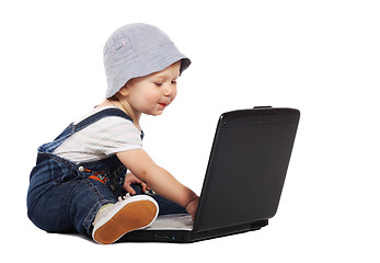Image showing Little boy with a laptop
