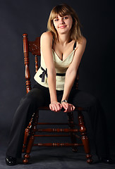 Image showing Girl sitting on a chair