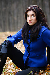 Image showing Young woman in the autumn park