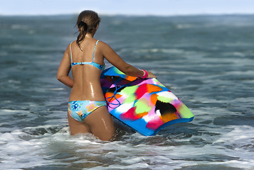 Image showing Woman with bodyboard  in the sea 