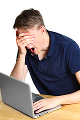 Image showing Teenage boy working on the laptop