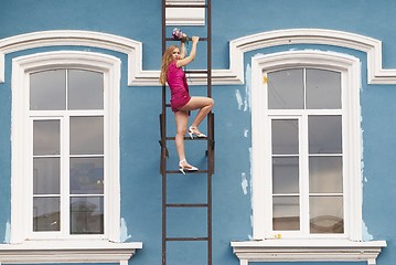 Image showing Young woman on stair