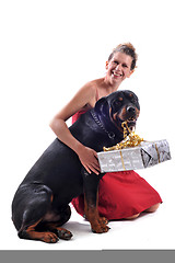 Image showing rottweiler, gift and woman