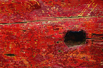 Image showing grunge park bench board painted red background 