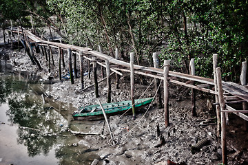 Image showing old row boat in mud