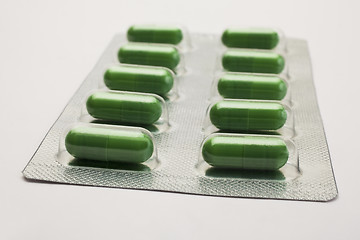 Image showing Green capsules