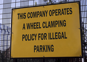 Image showing Wheel clamping sign