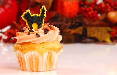 Image showing Halloween cupcake with fall foliage