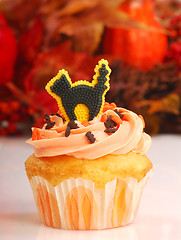 Image showing Halloween cupcake with fall foliage