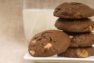 Image showing Triple chocolate chip cookies with milk