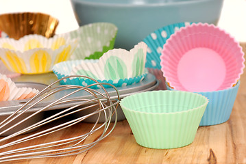 Image showing Variety of cupcake liners with wire wisk