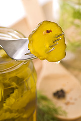 Image showing Preserving pickles with dill and peppercorns