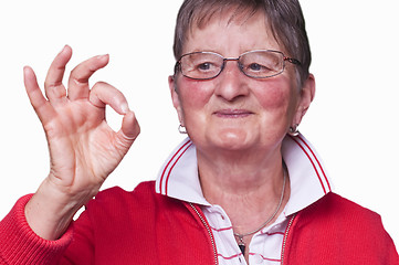 Image showing pensioner with sign all okay