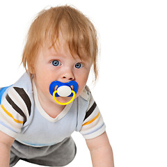 Image showing Attentive baby with a pacifier