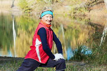 Image showing Woman making of the stretching in full nature 