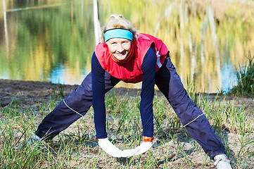 Image showing Woman making of the stretching in full nature 