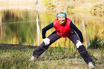 Image showing Woman making of the stretching in full nature 