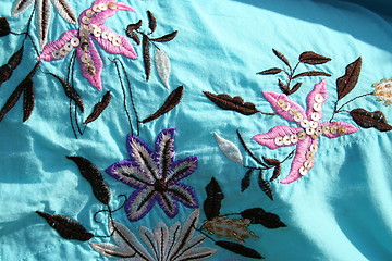 Image showing Wonderful embroideries on this material for skirts made in the Philippines