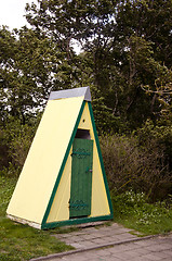 Image showing Decorative outdoor toilet wc near park trees 