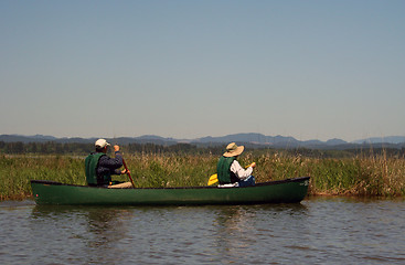 Image showing Couple Paddling Canoe