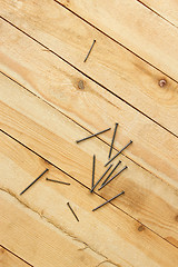 Image showing Nails on a wooden shield