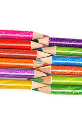 Image showing Assortment of coloured pencils with shadow on white background