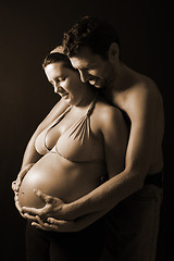 Image showing beautiful and happy & young pregnant couple 